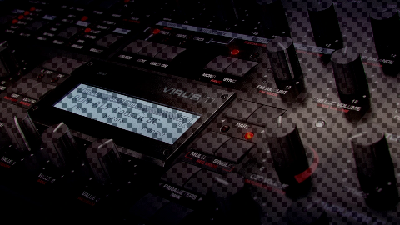 Access Virus TI synthesizer close-up showing display screen, knobs, and sound design controls in studio setup